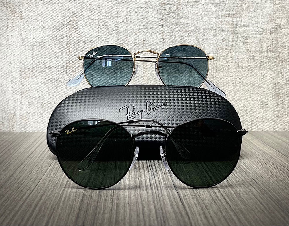 A pair of sunglasses with a matching case, displayed against a plain background.
